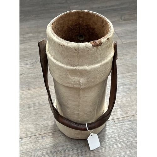 9007 - A George Crown cork shell carrier with brown leather handle, decal intact, painted in white