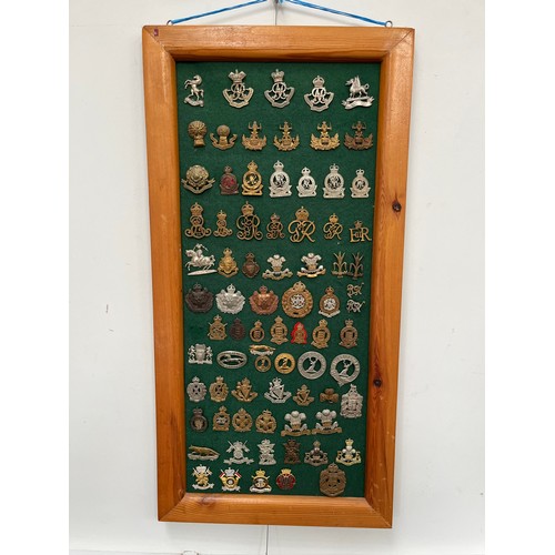 9153 - A display board of mainly yeomanry cap badges including Queen’s Own Oxfordshire Hussars, North Irish... 