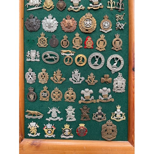 9153 - A display board of mainly yeomanry cap badges including Queen’s Own Oxfordshire Hussars, North Irish... 