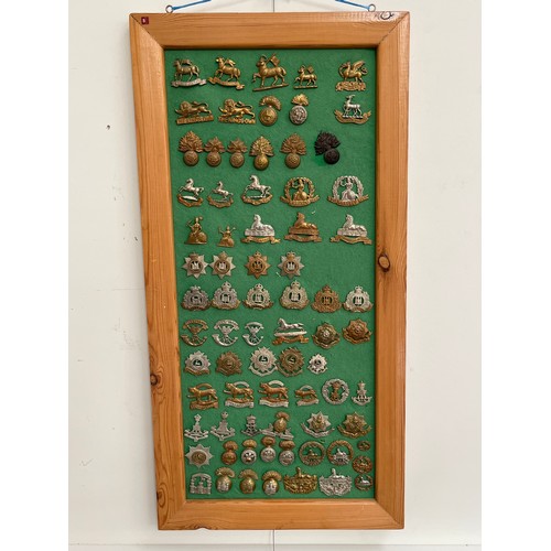 9163 - A board of British Infantry regiment badges including Suffolk Regiment, Norfolk Regiment and Leicest... 