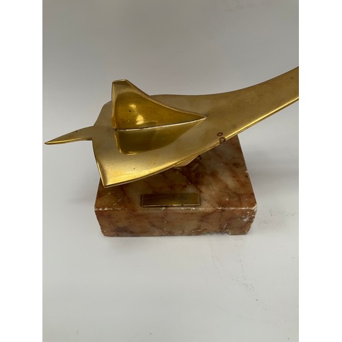 9127 - A stylised brass model of Concorde, upon a plinth base