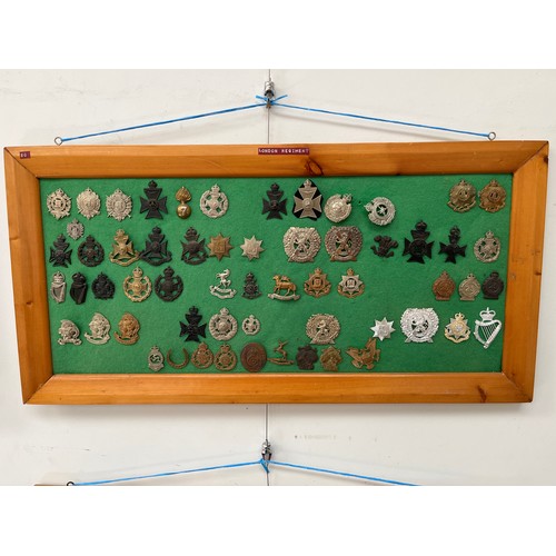 9169 - A framed collection of London regimental badges including London Scottish, and three Artists Rifles ... 