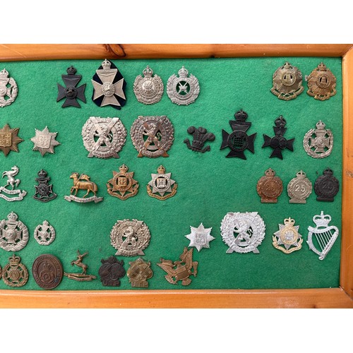 9169 - A framed collection of London regimental badges including London Scottish, and three Artists Rifles ... 