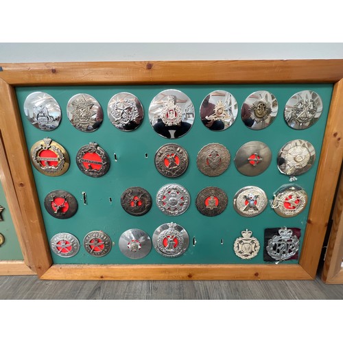 9180 - A framed display of brooch badges including Scottish and Gurkha regiments