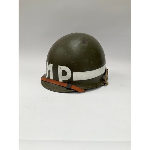 9085 - A post-war American helmet bearing MP (Military Police) lettering