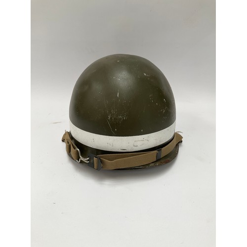 9085 - A post-war American helmet bearing MP (Military Police) lettering