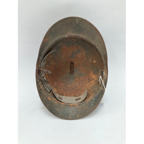 9086 - A WWI French Adrian helmet to the engineers with most of its original paint finish, no lining or chi... 