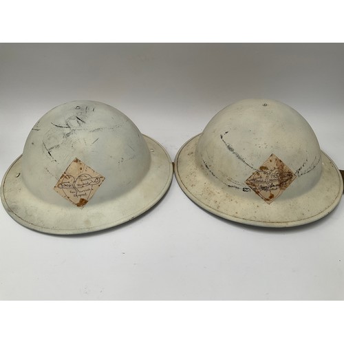 9087 - Two WWII 1942 dated British Army helmets with liners, repainted