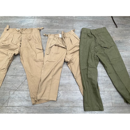 9048 - A box containing mixed British Army denim Battledress trousers and 1950 pattern trousers a/f