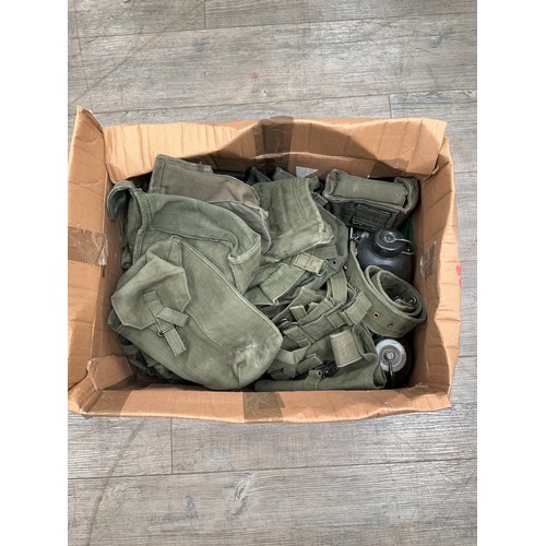 9065 - A box of 1957 pattern webbing including haversacks, pouches, binocular case and entrenching tool etc