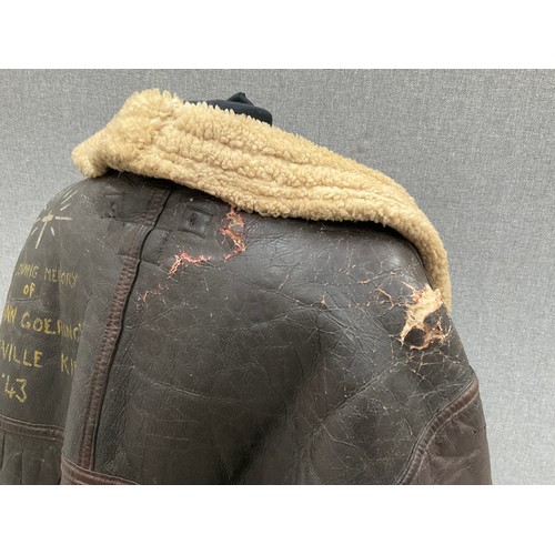 9077 - A WWII B3 sheepskin flying jacket by Perry Sportswear Co., with artwork to back, some wear requiring... 