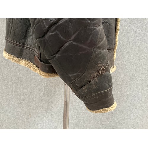 9077 - A WWII B3 sheepskin flying jacket by Perry Sportswear Co., with artwork to back, some wear requiring... 