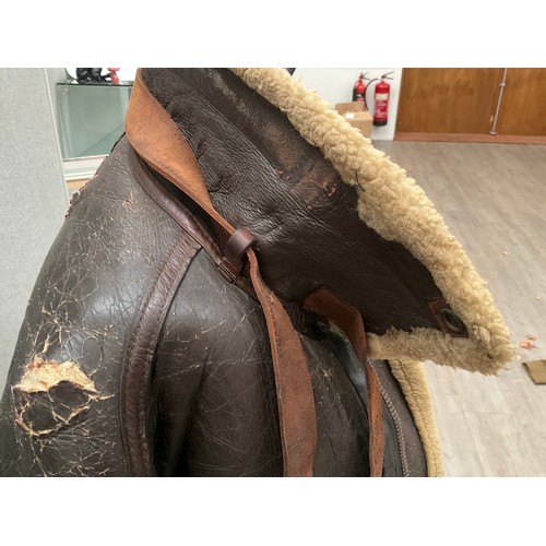 9077 - A WWII B3 sheepskin flying jacket by Perry Sportswear Co., with artwork to back, some wear requiring... 