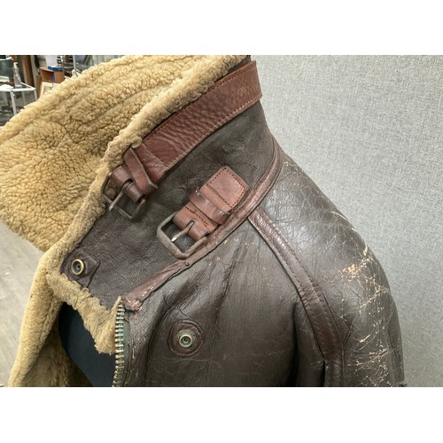 9077 - A WWII B3 sheepskin flying jacket by Perry Sportswear Co., with artwork to back, some wear requiring... 