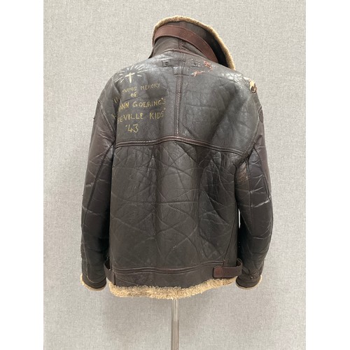 9077 - A WWII B3 sheepskin flying jacket by Perry Sportswear Co., with artwork to back, some wear requiring... 