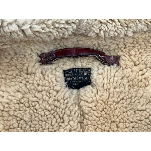 9077 - A WWII B3 sheepskin flying jacket by Perry Sportswear Co., with artwork to back, some wear requiring... 