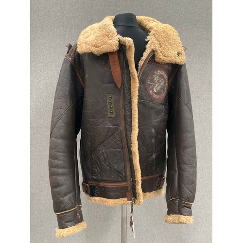 9078 - A WWII B3 sheepskin flying jacket by HLB Corp. New York, with artwork badge to front, size 46, repai... 