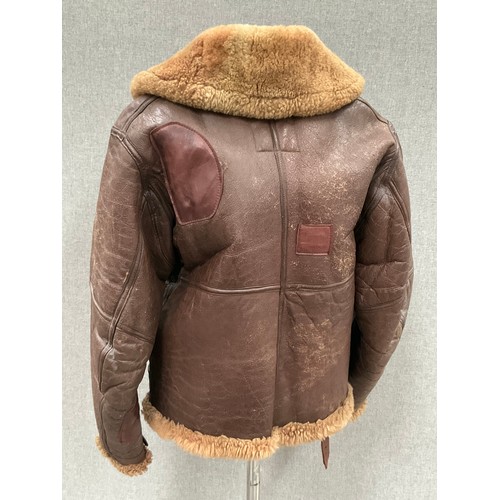 9076 - A WWII British Irvin sheepskin flying jacket, size 4, latch repairs present   (C)