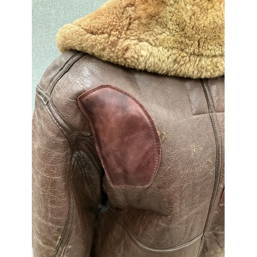 9076 - A WWII British Irvin sheepskin flying jacket, size 4, latch repairs present   (C)