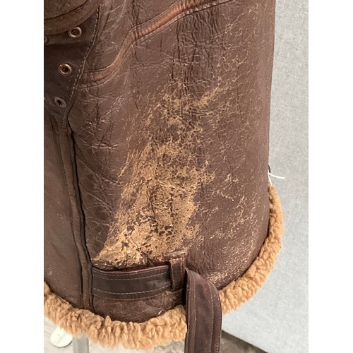 9076 - A WWII British Irvin sheepskin flying jacket, size 4, latch repairs present   (C)