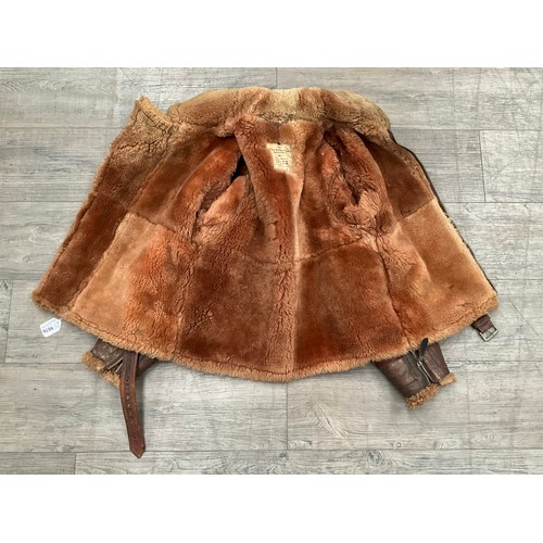 9076 - A WWII British Irvin sheepskin flying jacket, size 4, latch repairs present   (C)