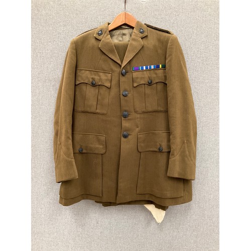 9070 - A British Army Chaplain's service jacket and trousers with insignia and medal bar   (C)