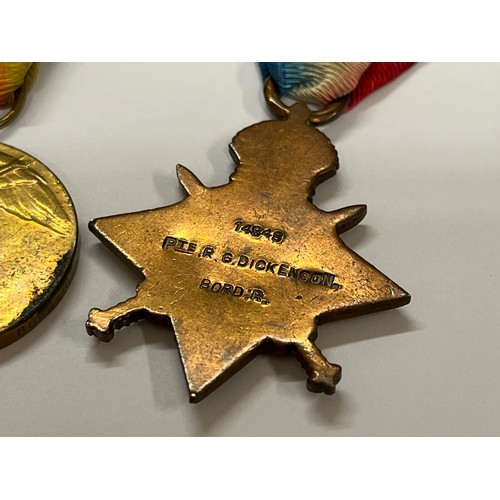 9330 - A WWI 1915 medal trio named to 14848 PTE. R.G. DICKINSON BORD. R. (named as DICKENSON on 1915 star),... 