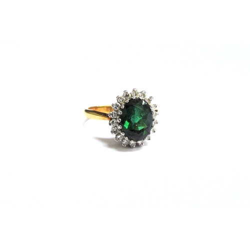 8058 - An 18ct gold tourmaline and diamond cluster ring. Size M, 4.5g