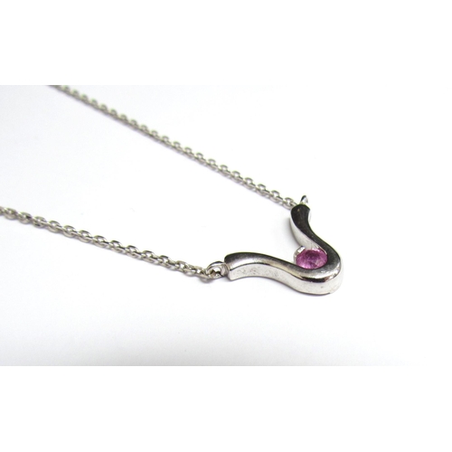 8081 - A 9ct white gold necklace hung with a pink sapphire set pendant, 42cm long, 3.3g   (E) £50-80