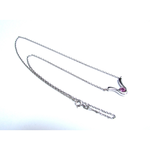 8081 - A 9ct white gold necklace hung with a pink sapphire set pendant, 42cm long, 3.3g   (E) £50-80