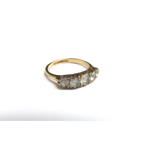 8084 - A 9ct gold five stone ring. Size K/L, 2.3g