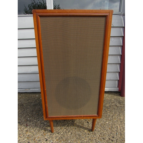 7466 - A large mid 20th Century teak cased speaker on associated tapering legs, speaker cabinet 76cm tall x... 
