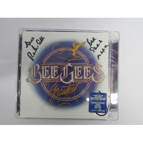 7299 - BEE GEES: 'Bee Gees Greatest' CD, booklet signed in marker pen by Robin Gibb 2011