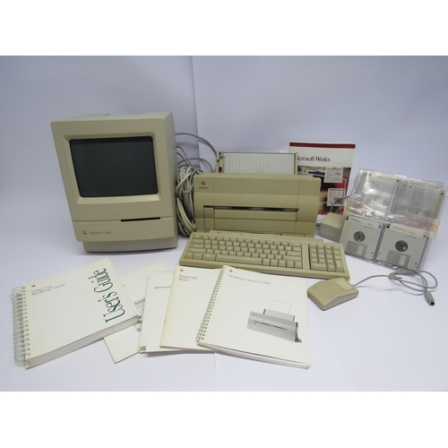 7462 - An Apple Macintosh Classic personal computer with Stylewriter printer, keyboard, mouse, floppy dics,... 