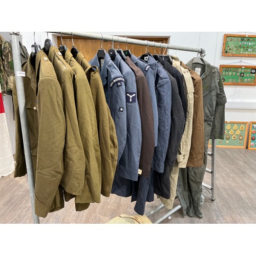 9102 - A large quantity of mixed military uniform including wartime or earlier Royal Navy officer's tunic