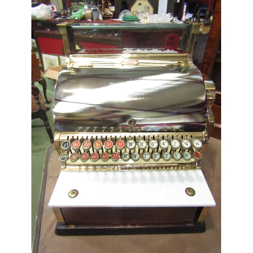 4008 - An NCR National Cash Register, model 748-SH, serial no. AV663158, highly polished case of brass and ... 