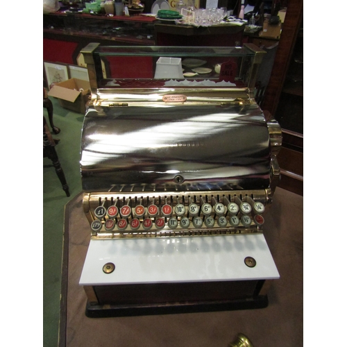 4008 - An NCR National Cash Register, model 748-SH, serial no. AV663158, highly polished case of brass and ... 