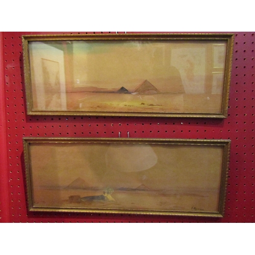 4049 - F. NEVIL: Two gilt framed watercolour wash paintings depicting Egyptian landscapes, and moored boat ... 