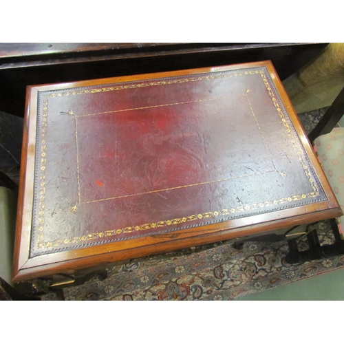 4087 - A Louis XIV walnut and rosewood small writing table, the gilt tooled leather writing surface over sq... 