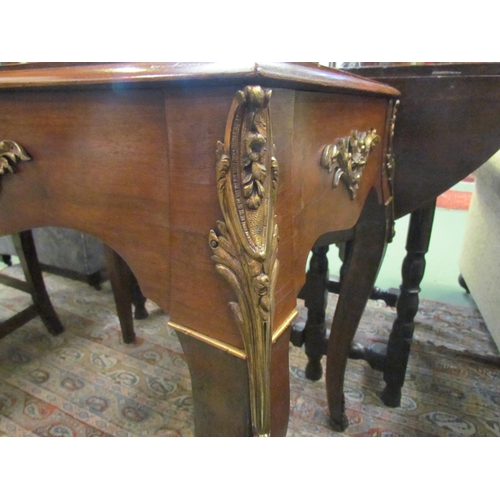 4087 - A Louis XIV walnut and rosewood small writing table, the gilt tooled leather writing surface over sq... 