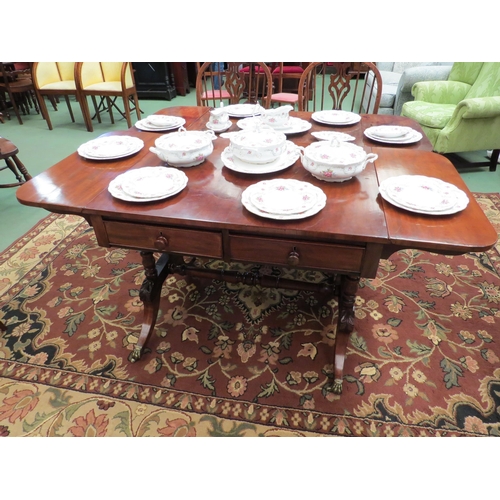 4100 - An early 19th Century flame mahogany sofa table the rising leaves over two frieze drawers on turned ... 