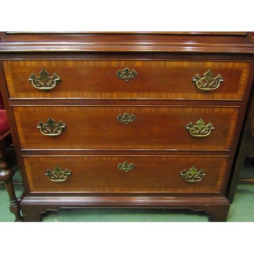 4132 - A George III style crossbanded mahogany tallboy of seven graduating long drawers over bracket feet, ... 