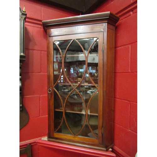 4133 - A George III line inlaid mahogany astragal glazed single door corner cabinet with adjustable shelves... 