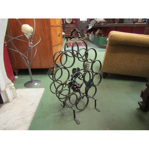 4147 - A wrought iron wine rack with grape and vine decoration, 62cm tall