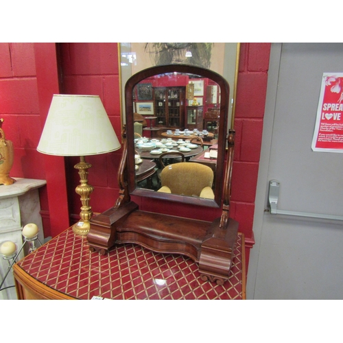 4152 - A Victorian mahogany dressing table mirror, the serpentine fronted lift-up central section flanked b... 