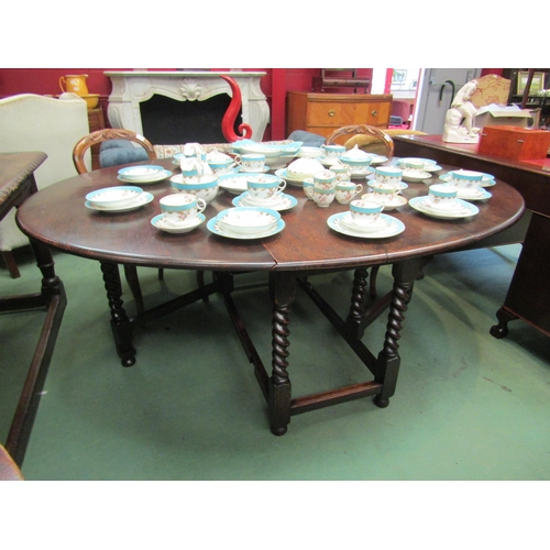 4161 - A large 18th Century revival oak oval top gate-leg dining table, the rising leaves over barley-twist... 