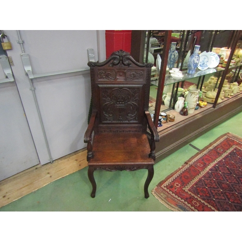 4162 - A Victorian 'Wainscot' armchair with carved mythical creatures having an acanthus leaf and fruit in ... 