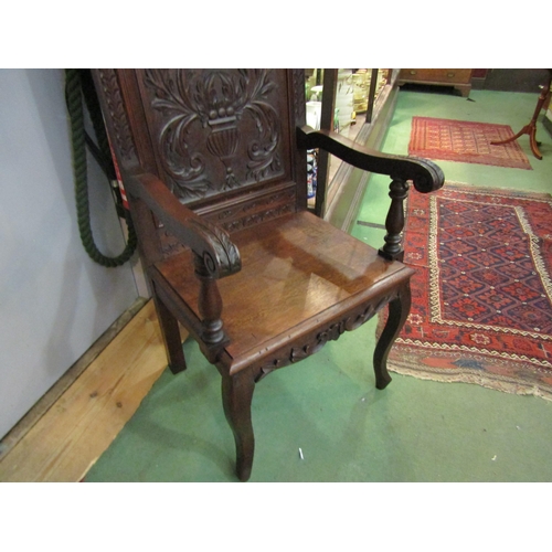 4162 - A Victorian 'Wainscot' armchair with carved mythical creatures having an acanthus leaf and fruit in ... 