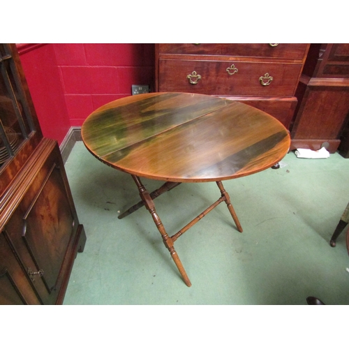 4171 - A 19th Century fruitwood folding coaching table, the circular hinged top on a turned leg and stretch... 