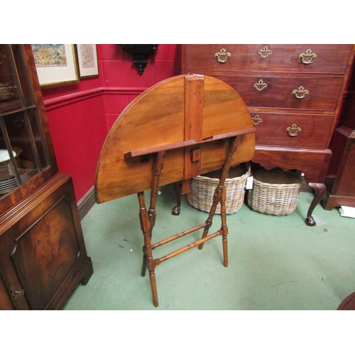 4171 - A 19th Century fruitwood folding coaching table, the circular hinged top on a turned leg and stretch... 